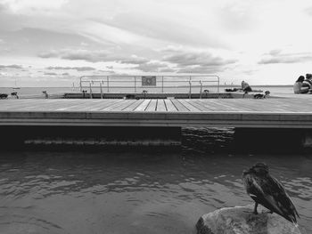 Pier over sea against sky