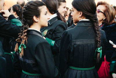 Rear view of woman looking at camera