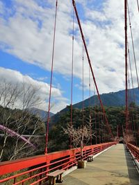 Suspension bridge against sky