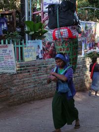 Full length of a young man using mobile phone