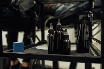 Close up of bottles with ink inside, essentials of creating tattoo at studio