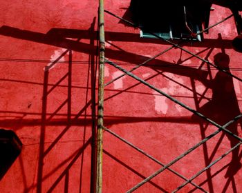 Low angle view of red wall