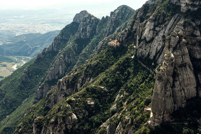 Scenic view of tree mountains against sky