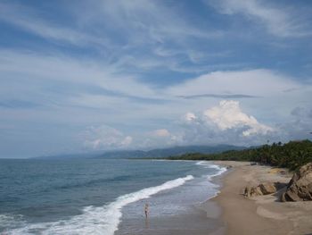 Scenic view of sea against cloudy sky