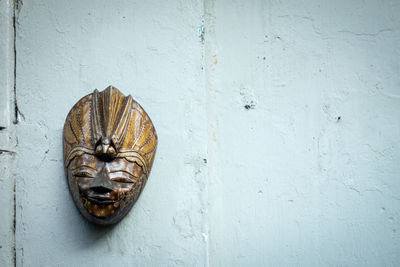 Close-up of old rusty metal mask