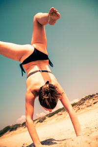 Young woman standing in the dark