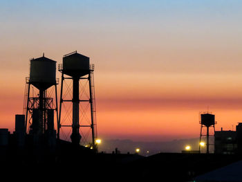 Silhouette built structure against sky during sunset