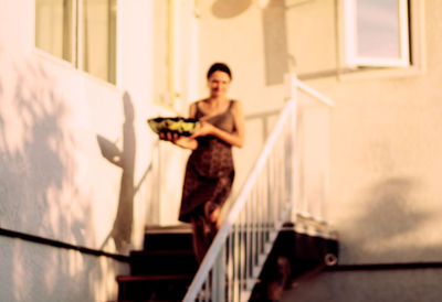 Young woman sitting at home