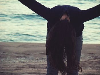 Close-up of woman standing on beach