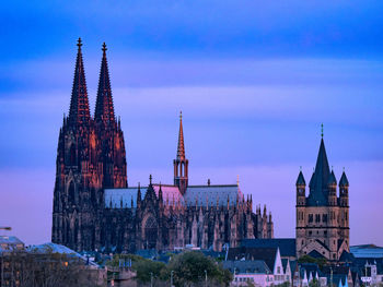 Panoramic view of buildings in city against sky