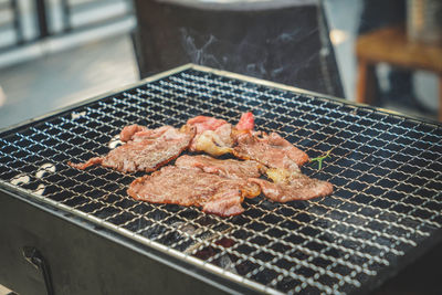 Close-up of meat on barbecue grill