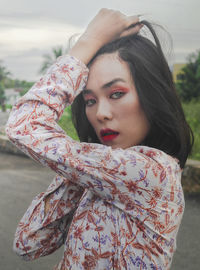 Portrait of beautiful woman standing outdoors