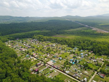 High angle view of trees and houses against sky