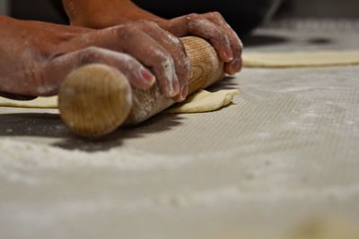 Cropped image of hands preparing food