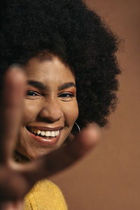 Close-up portrait of a smiling young woman