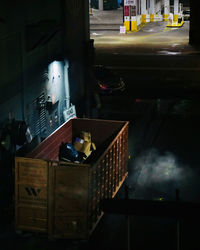 View of illuminated car on street against buildings at night