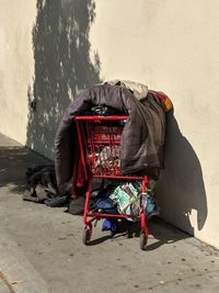 Blanket on shopping cart by wall