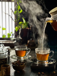 Glass of tea cup on table