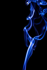 Close-up of smoke against black background