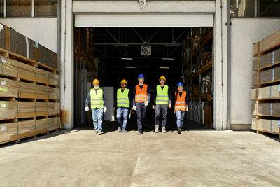Group of workers walking on factory yard