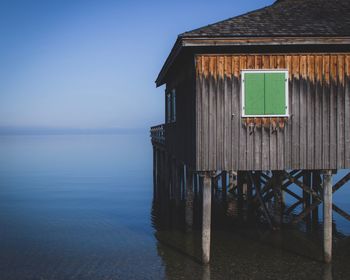 House by sea against sky