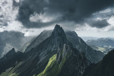 View of mountain range against cloudy sky