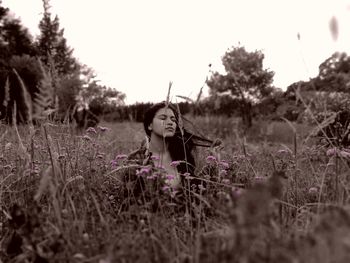 Woman on field against sky