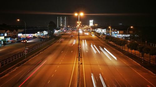 High angle view of light trails on road at night