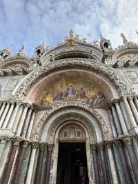 Low angle view of ornate building against sky