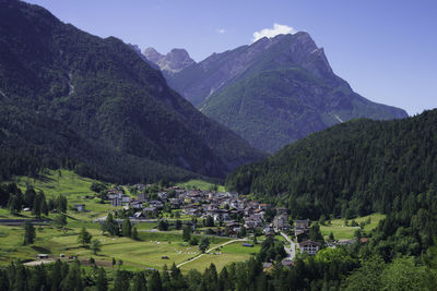 High angle view of townscape and mountains against sky