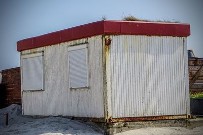 Exterior of old building against sky during winter