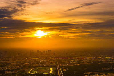 High angle view of buildings against sky during sunset