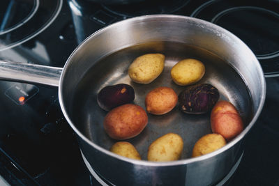 Close-up of vegetables in container on stove