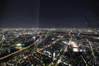 High angle view of illuminated modern buildings in city at night