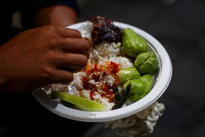 Close-up of person preparing food in bowl