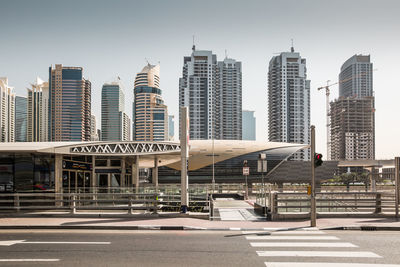 View of city buildings against clear sky