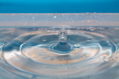 Close-up of drop splashing in water