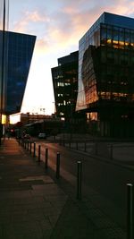 Buildings in city at sunset