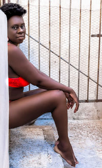 Young woman sitting outdoors