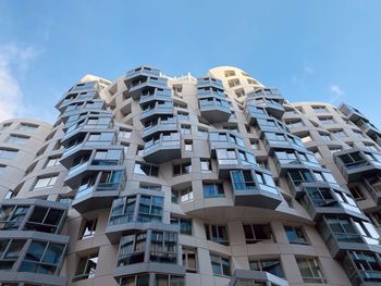 Low angle view of building against blue sky