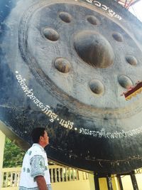 Low angle view of man standing in temple