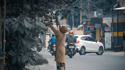 Man on street in city during winter