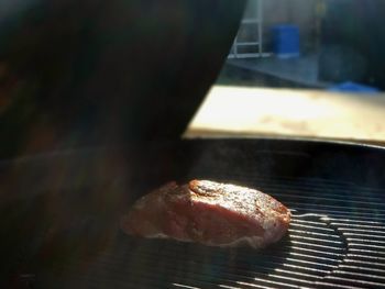 Close-up of meat on barbecue grill