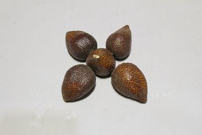 High angle view of candies against white background