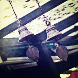 Close-up of padlocks hanging on railing