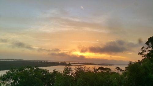 Scenic view of sea against sky at sunset