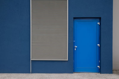 Closed blue door of building