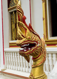 Statue outside temple against building