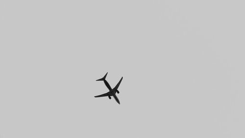 Low angle view of airplane flying in sky