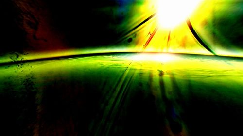 Abstract image of illuminated trees against sky during sunset